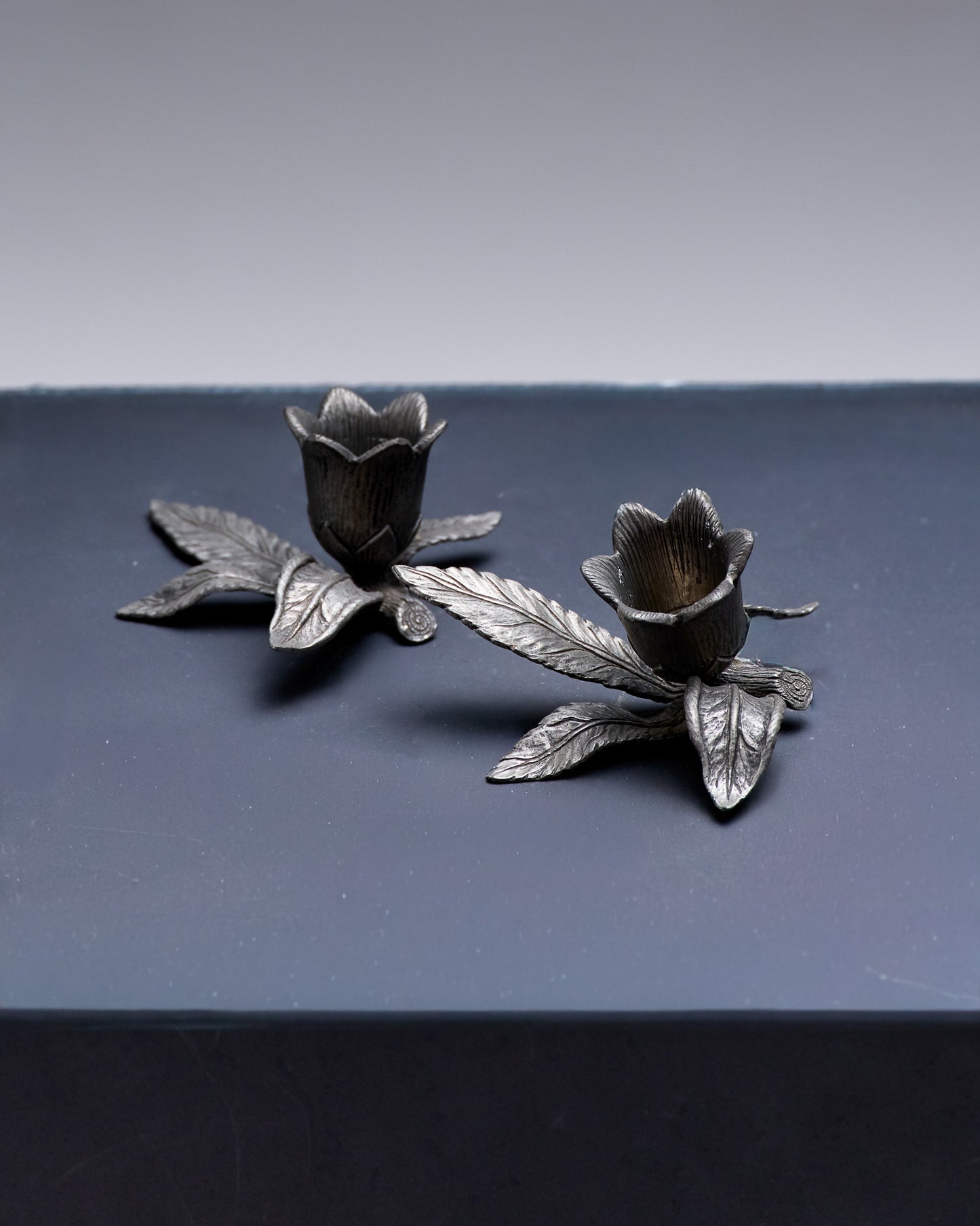 PAIR OF PEWTER FLOWER CANDLESTICKS, 1970S