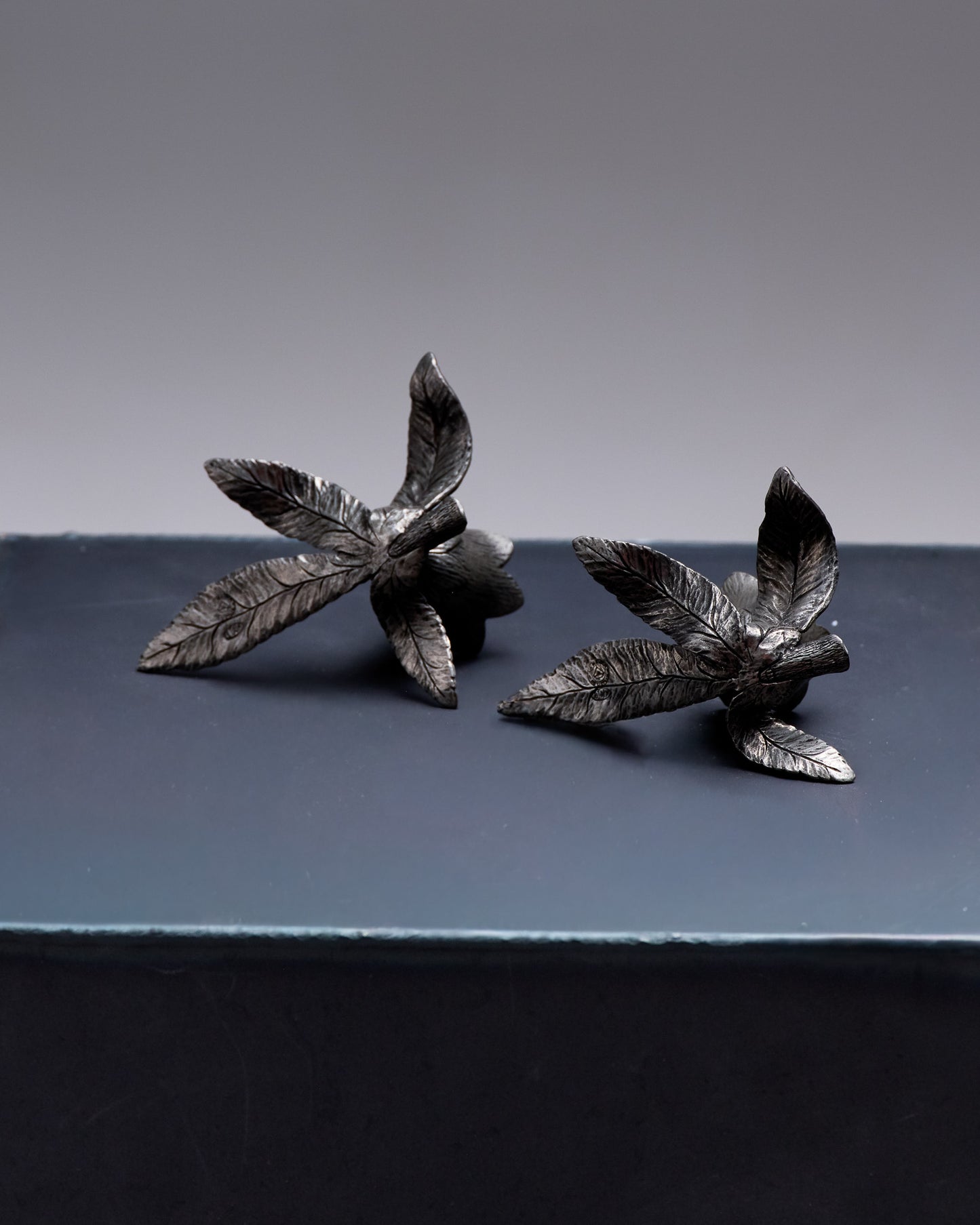 PAIR OF PEWTER FLOWER CANDLESTICKS, 1970S