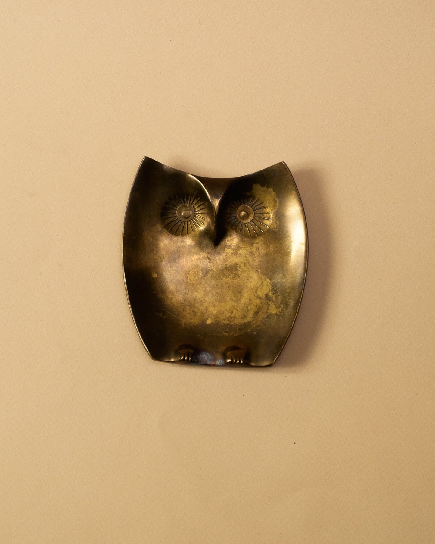 A bronze owl-shaped trinket tray 