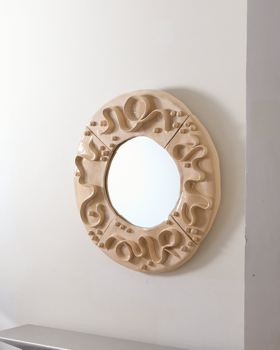 Enamelled ceramic mirror 