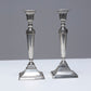 PAIR OF METAL FLAMBEAU CANDLESTICKS