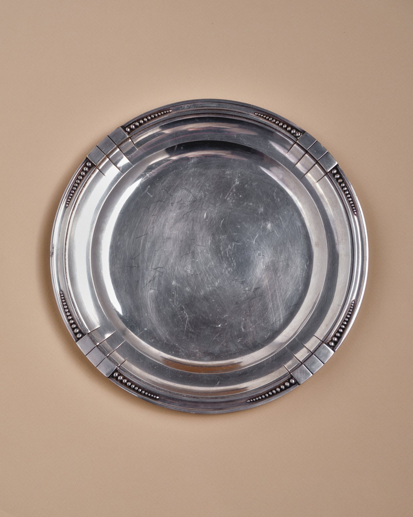 ROUND SILVER-PLATED METAL PLATE, SAMUEL ASKENFELD