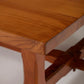 Table basse carrée en bois massif avec petite étagère sous le plateau. Très bon état.