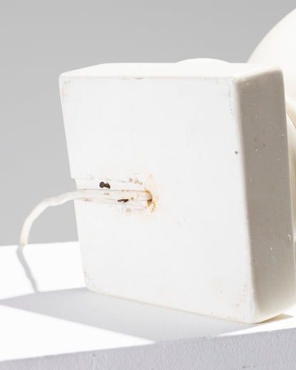 Luminous basin in white plaster