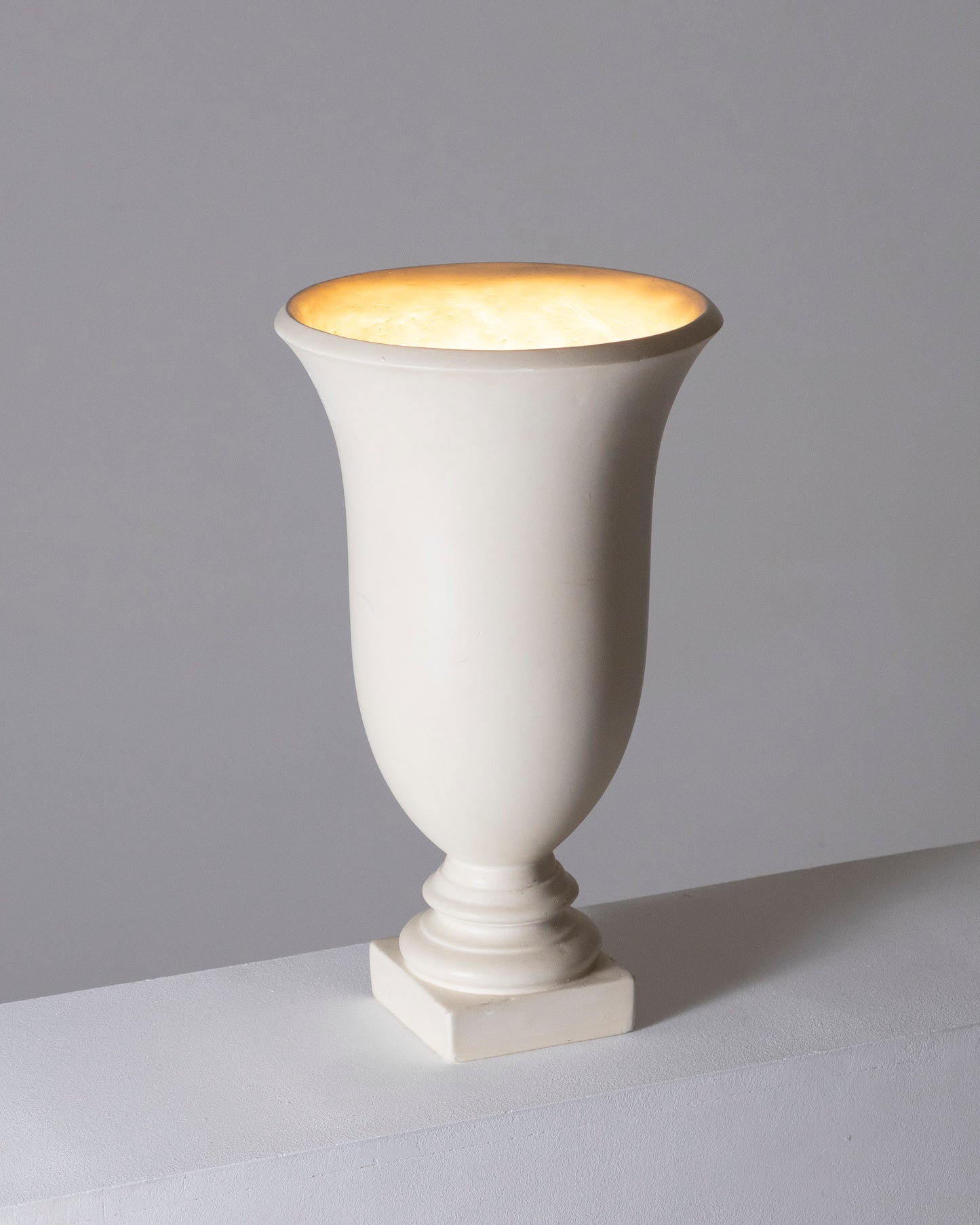 Luminous basin in white plaster