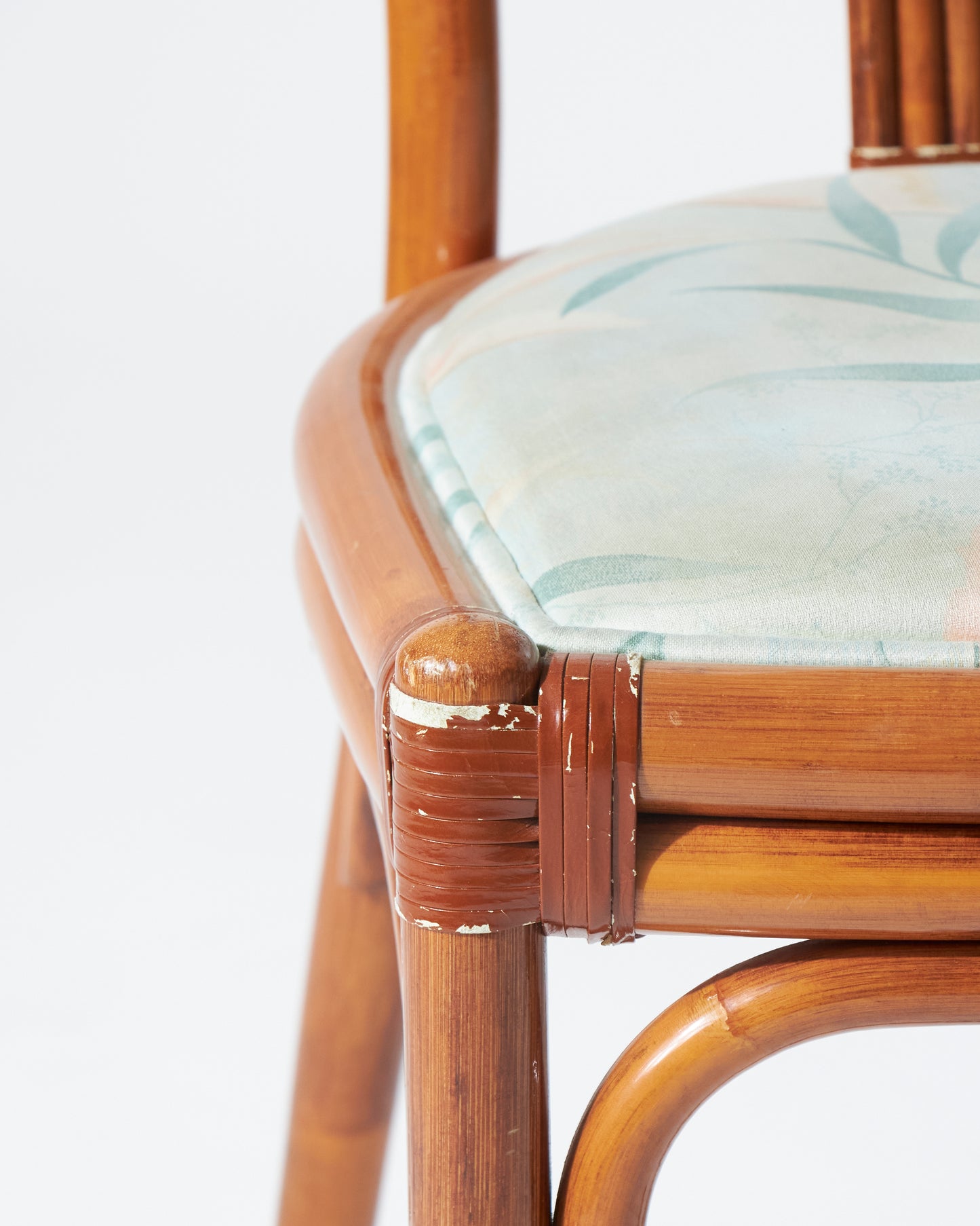 Rattan chair and blue flowery fabric