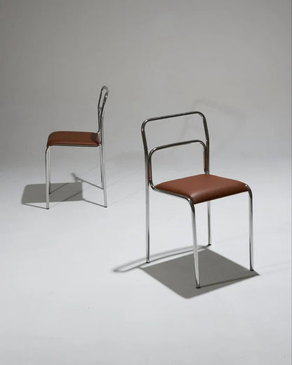 PAIR OF TUBULAR STEEL CHAIRS AND LEATHER, 1980S