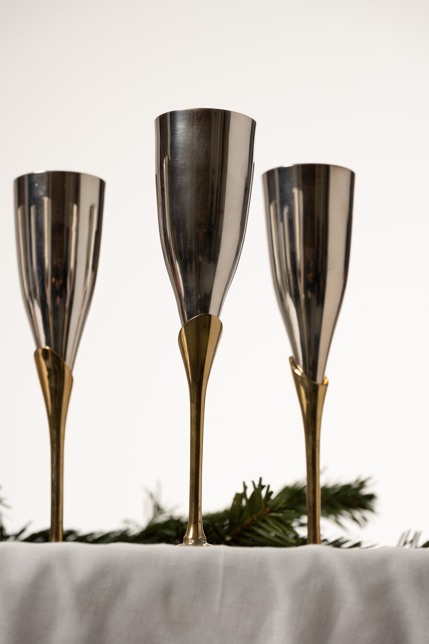 SET OF 6 METAL AND BRASS CHAMPAGNE FLUTES, 1980s